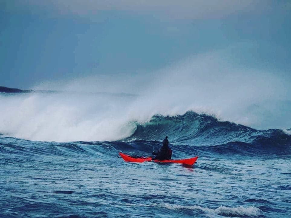 Sea kayak in a large breaking wave